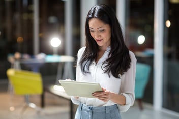 Businesswoman using digital tablet in the office