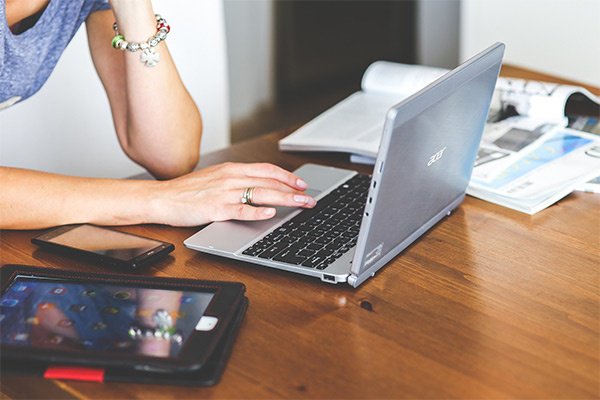 Woman browsing laptop.